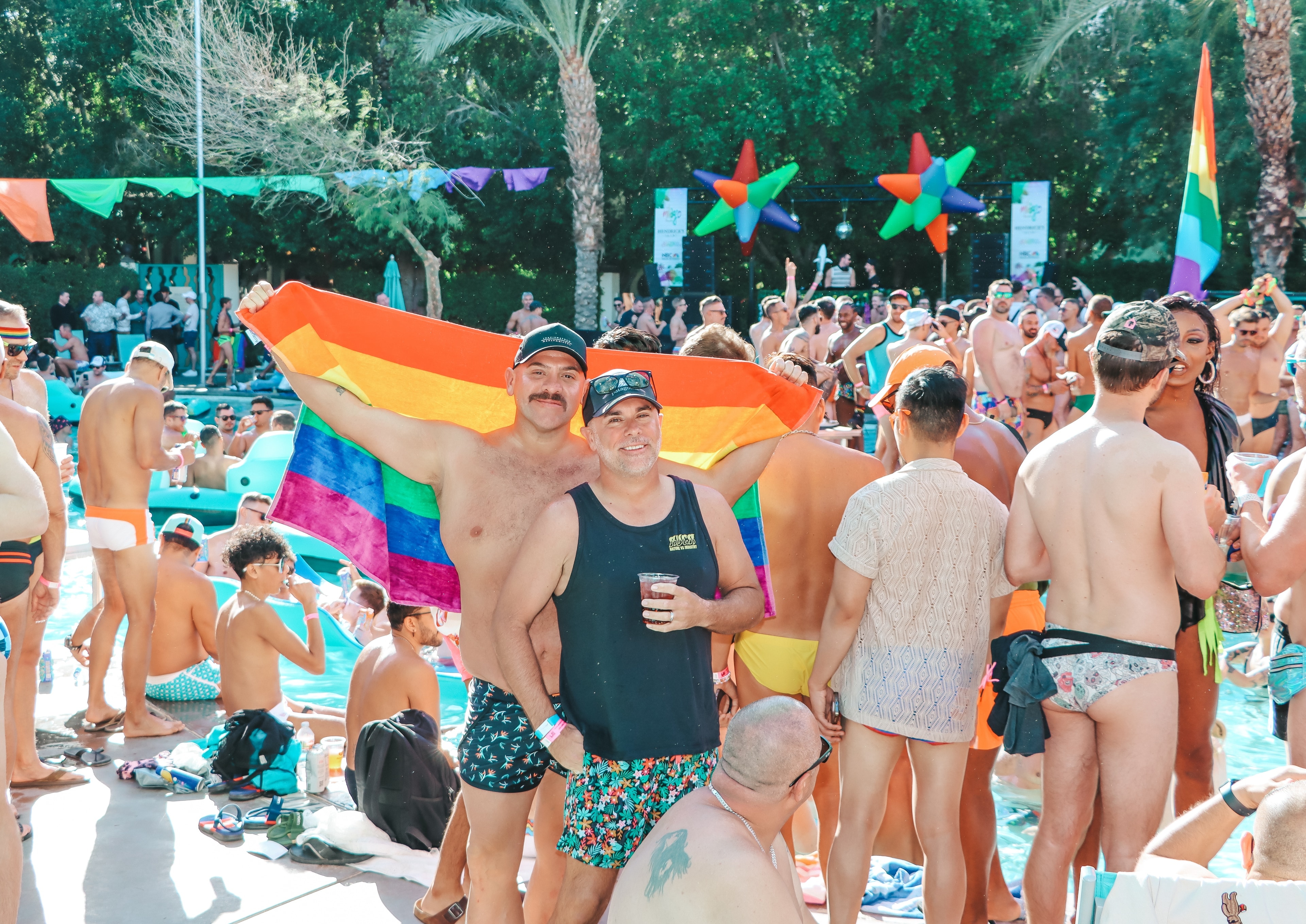 Pride pool party with rainbow flag